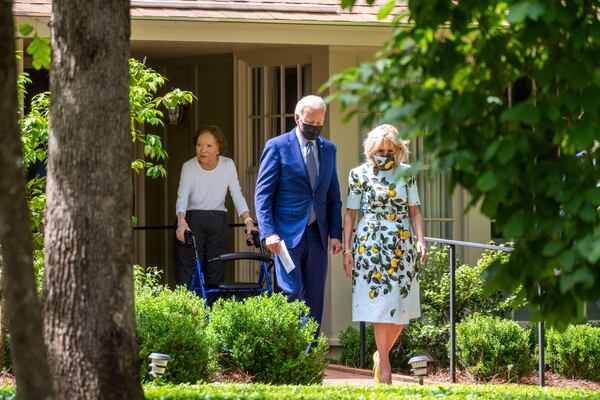 Rosalynn Carter stands on the front porch of her home as she watches President Joe Biden and first lady Jill Biden leave, after a visit with her husband, former President Jimmy Carter in Plains, Ga., Thursday, April, 29, 2021. (Doug Mills/The New York Times)