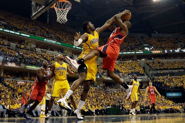 Indiana Pacers center Roy Hibbert, front left, tries to block the shot of Atlanta Hawks forward Paul Millsap during the first half in Game 7 of a first-round NBA basketball playoff series in Indianapolis, Saturday, May 3, 2014. (AP Photo/AJ Mast) The story of Game 7: Roy Hibbert stuffs Paul Millsap. (AJ Mast/AP)