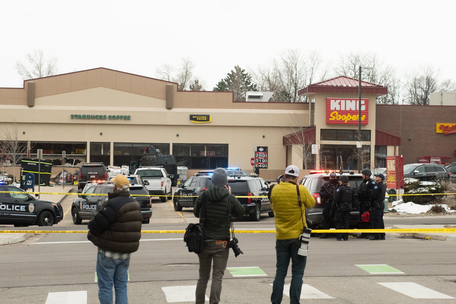 Police vehicles in the parking lot of the Boulder King Soopers grocery store after a shooting that killed multiple people in Boulder, Colo., on Monday, March 22, 2021. (Theo Stroomer/The New York Times)