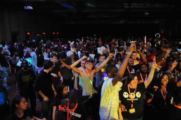 Revelers enjoy the Saturday Night Dance, an electronic music dance party featuring renowned DJs, at a previous Anime Weekend Atlanta. This year's edition offers raves on the nights of Dec. 13 and 14. (Courtesy)