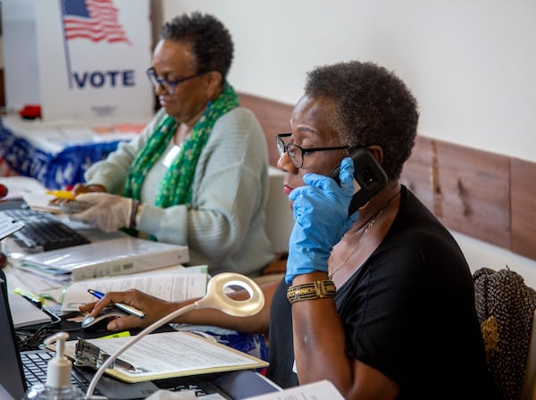 Poll worker Jumaine Russell works on an advanced early voting form at Johns Creek polling station  Saturdays March 14, 2020.  STEVE SCHAEFER / SPECIAL TO THE AJC