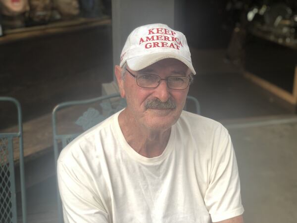 Larry Houston supports President Donald Trump, saying Democrats “just can’t realize how much better he’s making the country.” Houston, who runs an antique shop in Milledgeville, says he doesn’t mind the push for impeachment, though. It’s helped him sell seven or eight dozen hats that say “KEEP AMERICA GREAT.”