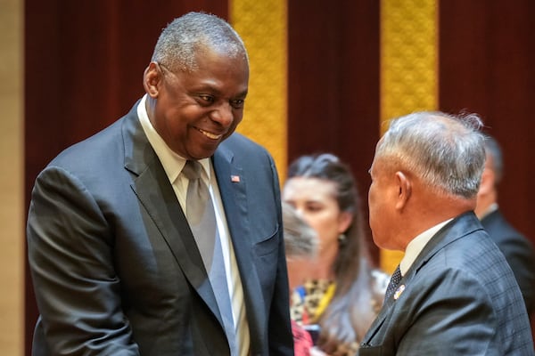 U.S. Defence Secretary Lloyd Austin, left, shakes hands with Brunei's Defence Minister II Halbi Bin Mohammad Yussof during the ASEAN Defence Ministers' informal Meeting in Vientiane, Laos, Wednesday, Nov. 20, 2024. (AP Photo/Anupam Nath)