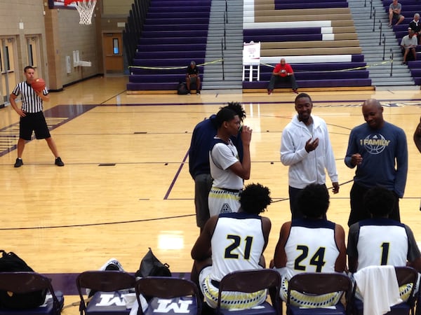 Georgia Tech assistant coach Darryl LaBarrie (seated across the court, in black) attended an AAU game in Las Vegas on Friday that the player he is recruiting, Nassir Little, did not play in.