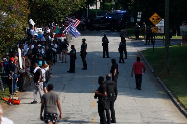 Rice Street is blocked to through traffic as security measures are tightened ahead of the arrival of former President Donald Trump. (Miguel Martinez /miguel.martinezjimenez@ajc.com)