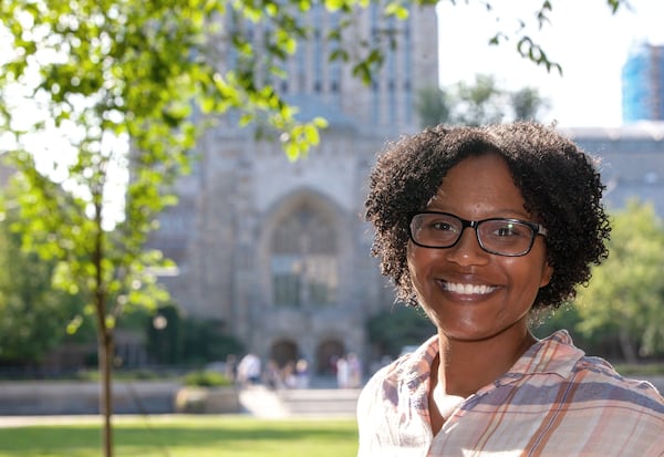 Chelesa Fearce, a Clayton County student who overcame homelessness to become her high school class valedictorian in 2013, stands in front of the Sterling Memorial Library at Yale University. She is working on her doctorate and a medical degree at the Yale School of Medicine. (Michelle McLoughlin for The Atlanta Journal-Constitution)