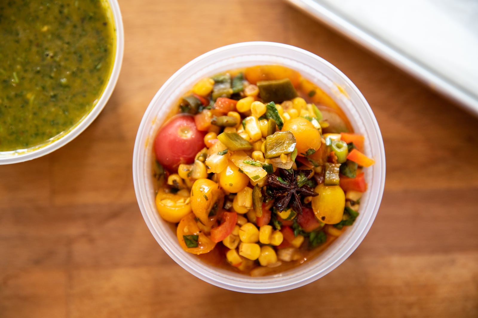 Poco Loco marinated tomato and corn salsa. (Mia Yakel for The Atlanta Journal-Constitution)