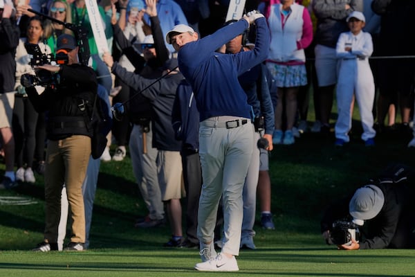 Rory McIlroy, of Northern Ireland, hits from the 16th tee during a playoff round of The Players Championship golf tournament Monday, March 17, 2025, in Ponte Vedra Beach, Fla. (AP Photo/Chris O'Meara)