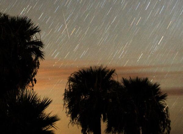 A Perseid meteor streaks across the sky early Tuesday near Rogers Spring in the Lake Mead National Recreation Area, Nev. The meteor display is known as the Perseid shower because it appears to radiate from the constellation Perseus in the northeastern sky, and is a result of Earth's orbit passing through debris from the comet Swift-Tuttle.