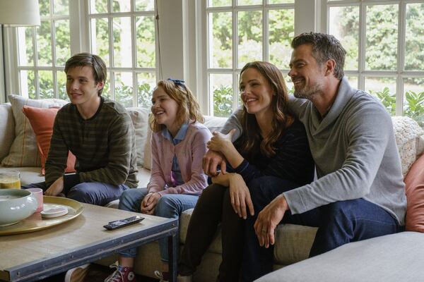 Nick Robinson (left) stars as Simon, and Talitha Bateman, Jennifer Garner and Josh Duhamel play his family in “Love, Simon.” CONTRIBUTED BY BEN ROTHSTEIN / TWENTIETH CENTURY FOX