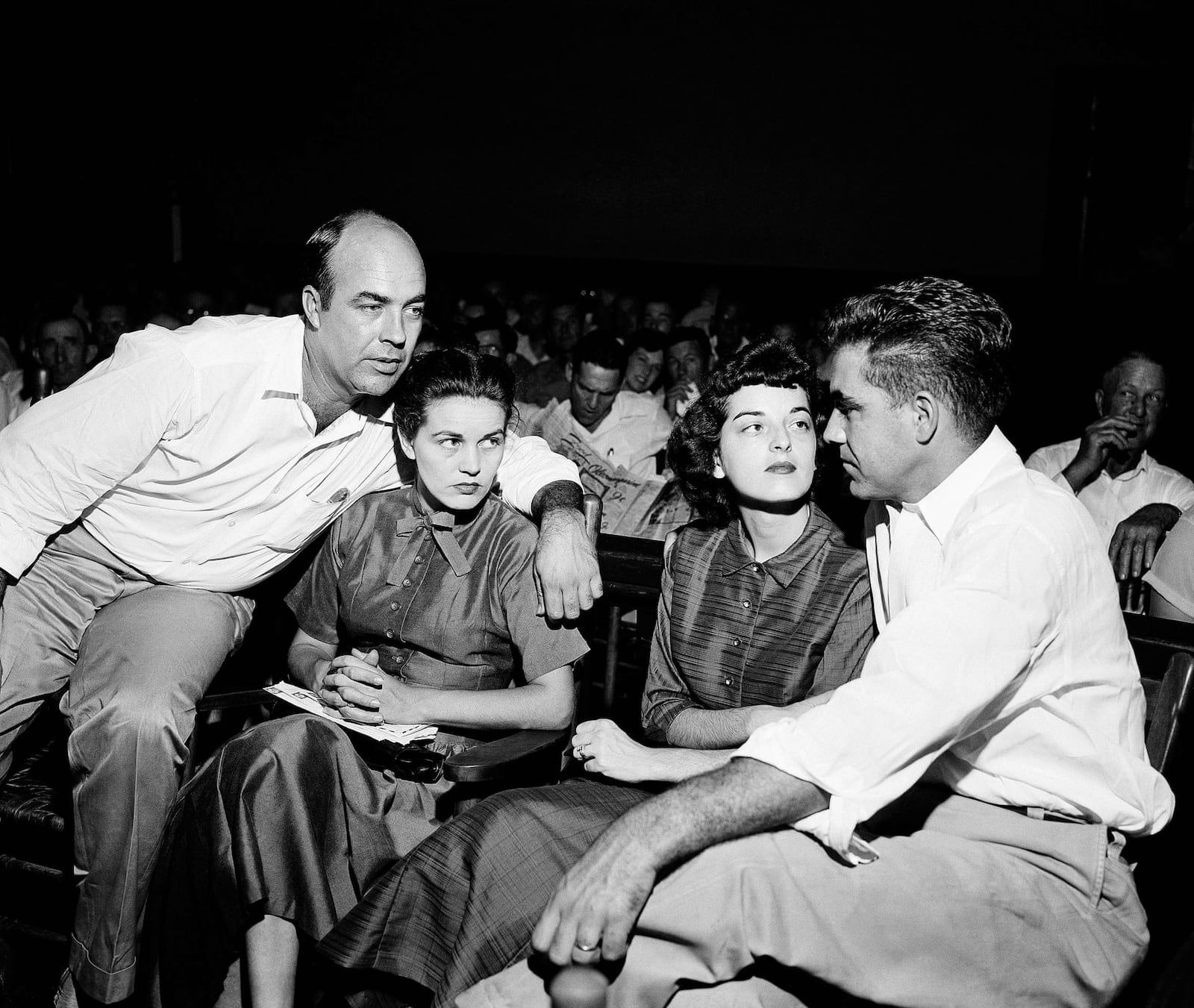 In this September 1955 file photo, J.W. Milam, left, and Roy Bryant, right, sit with their wives in a courtroom in Sumner, Mississippi. Milam and Bryant were acquitted of the murder of Emmett Till.