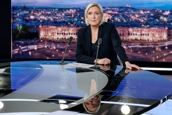 French far-right leader Marine Le Pen poses prior to an interview on French TV channel TF1, in Boulogne-Billancourt, outside Paris, Wednesday, Dec. 4, 2024 after France's far-right and left-wing lawmakers joined together to vote a no-confidence motion prompted by budget disputes that forces Prime Minister Michel Barnier to resign. (Stephane de Sakutin, Pool via AP)