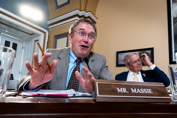 FILE - Rep. Thomas Massie, R-Ky., joined at right by Rep. Ralph Norman, R-S.C., both members of the conservative House Freedom Caucus, speaks as the House Rules Committee meets to prepare the debt limit bill, at the Capitol in Washington, May 30, 2023. (AP Photo/J. Scott Applewhite, File)