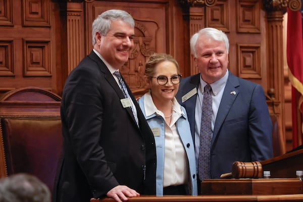 (Left to right) Republican state Rep. John Carson of Marietta, from left, Democratic state Rep. Esther Panitch of Sandy Springs and Georgia House Speaker Jon Burns gathered for a photo after the final passage of a bill making antisemitism part of the state's hate crimes law. (Natrice Miller/ Natrice.miller@ajc.com)