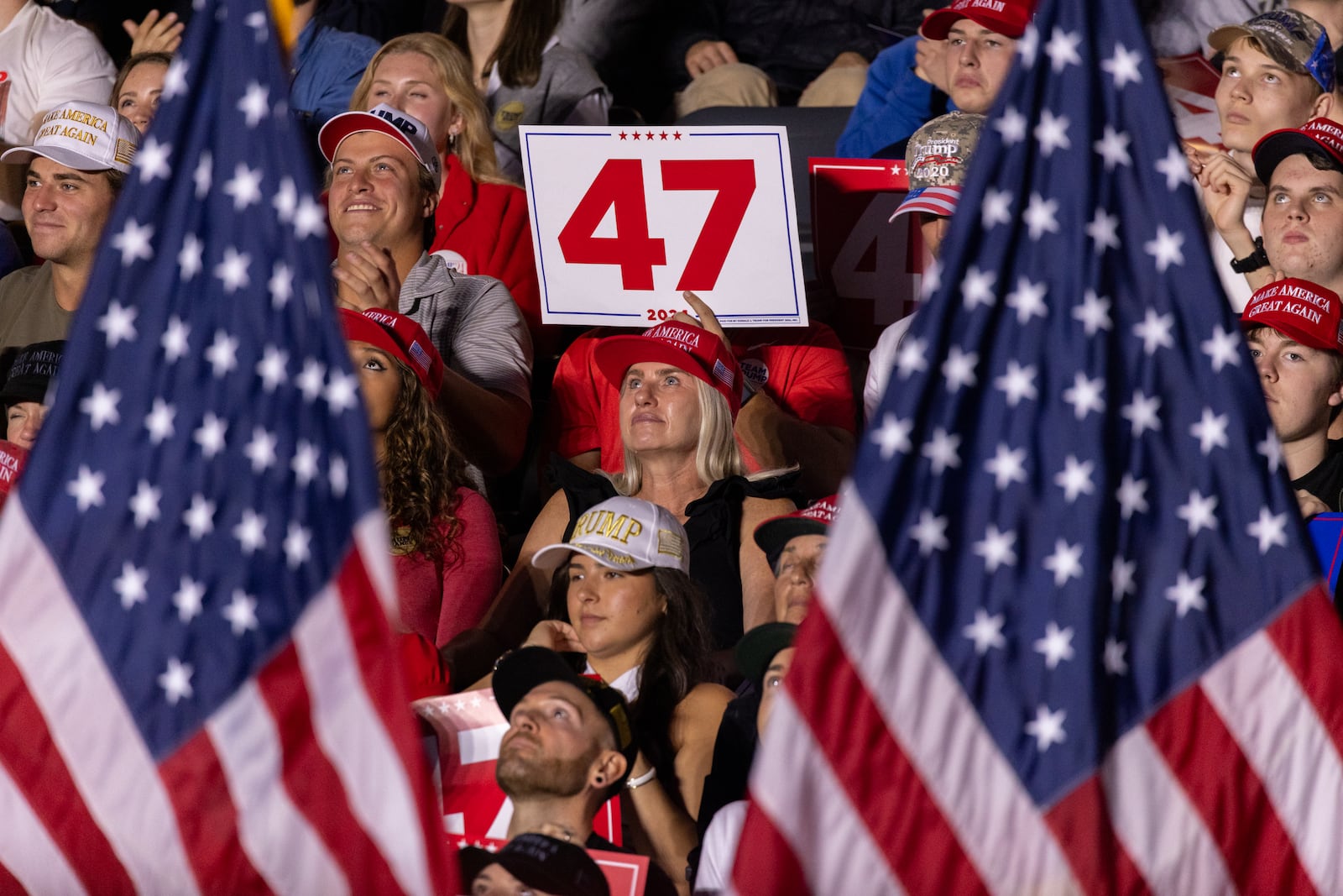 Supporters watch the screen at Republican presidential candidate Donald Trump’s rally at McCamish Pavilion at Georgia Tech in Atlanta on Monday, October 28, 2024. (Arvin Temkar / AJC)