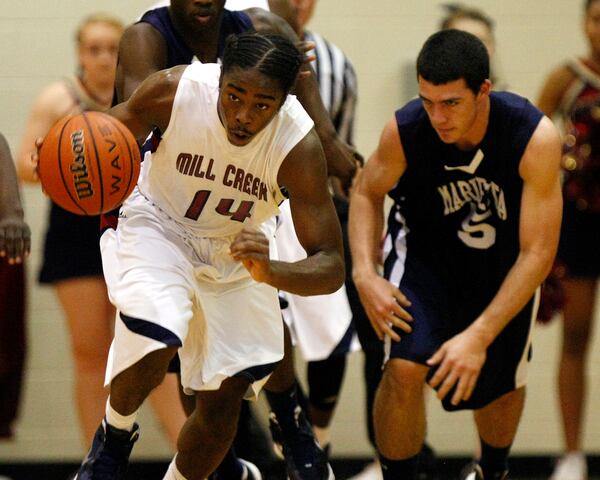 From December 2011: Marietta High School's Dansby Swanson (right) fights for a loose ball with Mill Creek's Trevon Shaw. (Curtis Compton/ccompton@ajc.com)