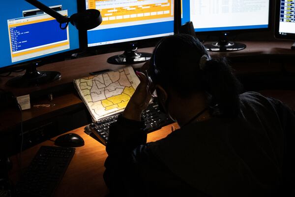 Shundana Griggs is a 21-year veteran at the call center. (Casey Sykes for The Atlanta Journal-Constitution)