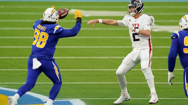 Falcons quarterback Matt Ryan (2) throws over Los Angeles Chargers defensive end Isaac Rochell (98) during the second half Sunday, Dec. 13, 2020, in Inglewood, Calif. (Ashley Landis/AP)