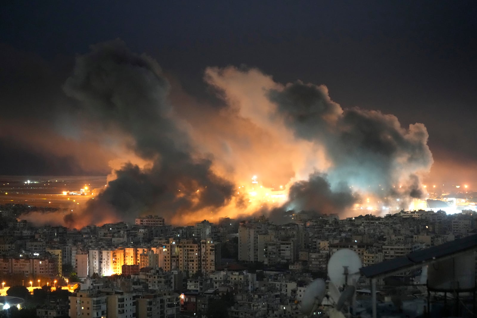 Flames and smoke rise form Israeli airstrikes on Dahiyeh, in the southern suburb of Beirut, Lebanon, Sunday, Oct. 20, 2024. (AP Photo/Hussein Malla)