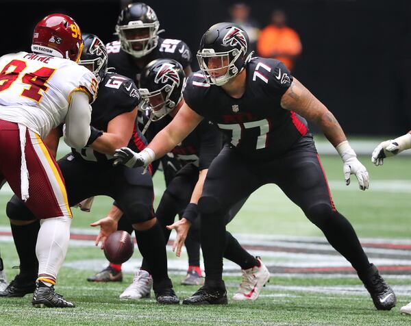 Falcons rookie offensive lineman Jalen Mayfield looks to block for Matt Ryan against the Washington Football Team in the fourth quarter Sunday, Oct. 3, 2021, at Mercedes-Benz Stadium in Atlanta. (Curtis Compton / Curtis.Compton@ajc.com)