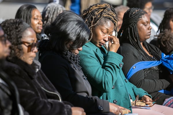 SAVANNAH, GA - FEBRUARY 01, 2024: Breonna Moffett's Aunt Nimba Burgess, center, wipes a tear from her eyes during a ceremony to honor the memory of her neice, Thursday, Feb. 1, 2024, at Windsor Forest High School in Savannah, Ga. Moffett was one of three Georgia solders killed in a drone attack Jan. 28, 2024 in Jordan. (AJC Photo/Stephen B. Morton)