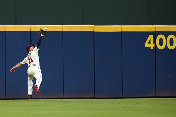 Ender Inciarte catches a ball hit by Daniel Descalso of the Colorado Rockies. (Photo by Kevin Liles/Getty Images)