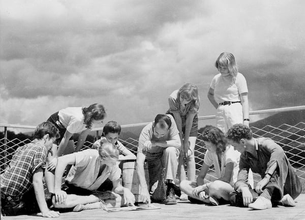 Black Mountain College fostered non-traditional learning in the visual and performing arts during the 1960s and '70s. Here, architect-teacher of Black Mountain College Lawrence Kocher, center, and a group of students hold a discussion session on the sun deck of the studies building in Black Mountain, N.C., Feb. 20, 1944. (AP Photo)