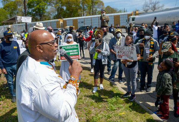 Event facilitator Derrick Boazman, host of WAOK 1380 News and Talk, addresses participants gathered at the site of the former Chattahoochee Brick Company during a sacred event to commemorate the lives lost during the period the company used the convict lease system. The event included a procession, prayers, libations, community testimonials and site consecration Saturday, April 3, 2021, in Atlanta. (Photo: Daniel Varnado for The Atlanta Journal-Constitution)