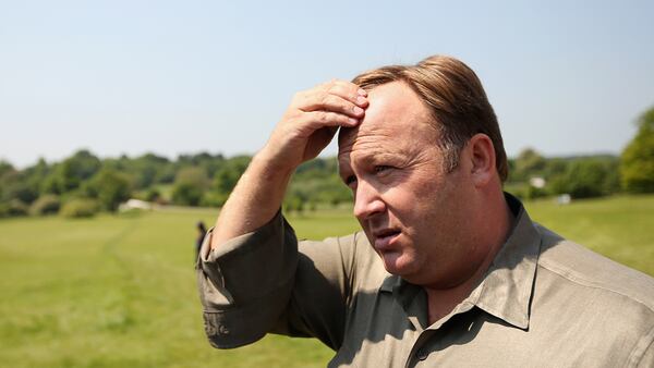 WATFORD, ENGLAND - JUNE 06:  Alex Jones, an American radio host, author and conspiracy theorist, addresses media and protesters in the protester encampment outside The Grove hotel, which hosted the annual Bilderberg conference, on June 6, 2013 in Watford, England. The traditionally secretive conference, which has taken place since 1954, was expected to be attended by politicians, bank bosses, billionaires, chief executives and European royalty.  (Photo by Oli Scarff/Getty Images)