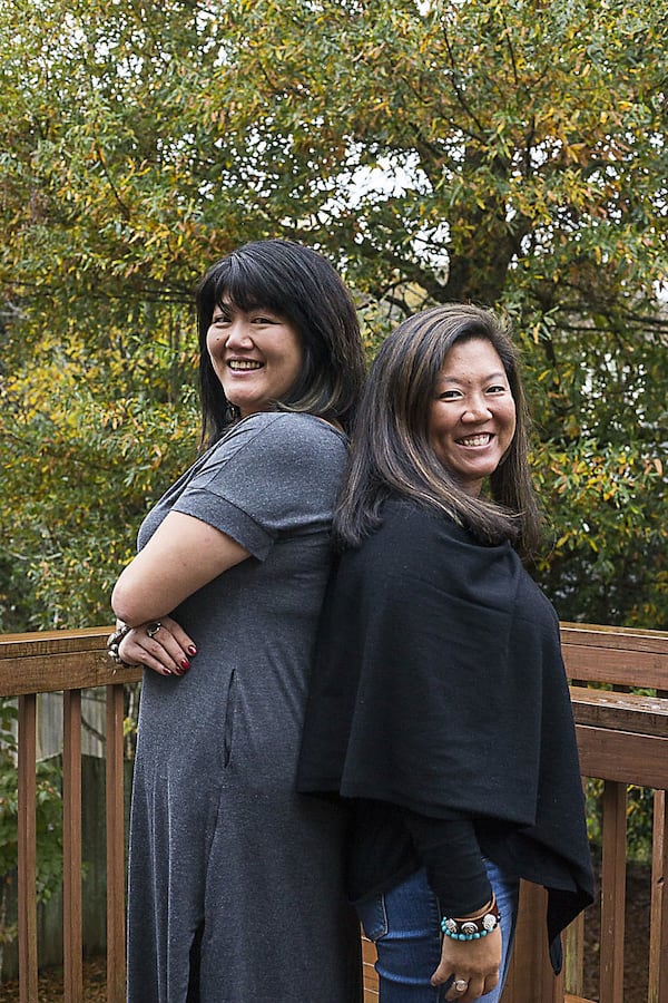 After Janine Dzyubanny (left) took a DNA test with 23andMe, she found out she had a sister: Jennifer Franz. Here, they’re posing together in Johns Creek. ALYSSA POINTER / ALYSSA.POINTER@AJC.COM