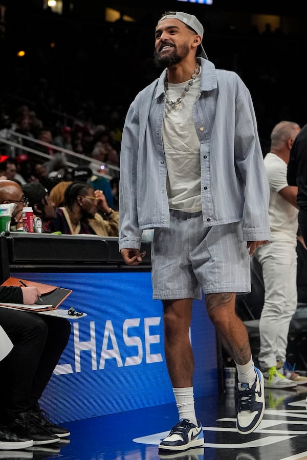 Atlanta Hawks guard Trae Young walks on the court during the first half of an NBA basketball game against the Philadelphia 76ers, Monday, March 10, 2025, in Atlanta. (AP Photo/Mike Stewart)