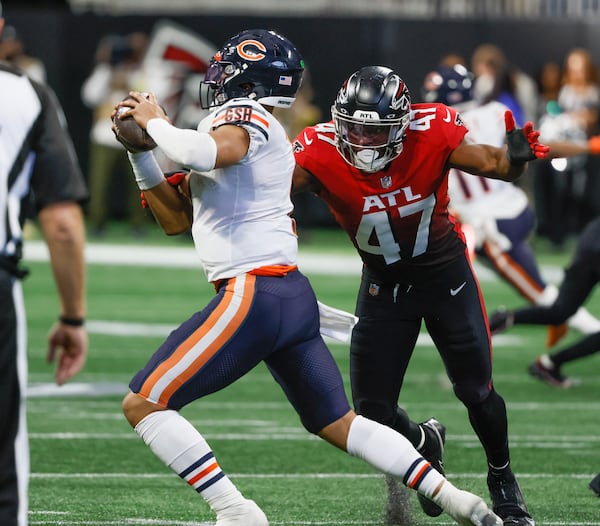 Atlanta Falcons defensive end Arnold Ebiketie (47) closes in for a sack on Chicago Bears quarterback Justin Fields (1) during the third quarter of an NFL football game between the Atlanta Falcons and the Chicago Bears In Atlanta on Sunday, Nov. 20, 2022.  The Falcons won 27-24. (Bob Andres for the Atlanta Journal Constitution)