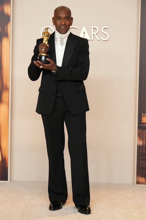 Paul Tazewell, winner of the award for best costume design for "Wicked," poses in the press room at the Oscars on Sunday, March 2, 2025, at the Dolby Theatre in Los Angeles. (Photo by Jordan Strauss/Invision/AP)