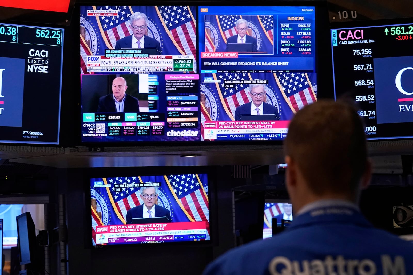 Comments by Federal Reserve Chair Jerome Powell appear on a bank of screens on the floor of the New York Stock Exchange, Thursday, Nov. 7, 2024, in New York. (AP Photo/Richard Drew)