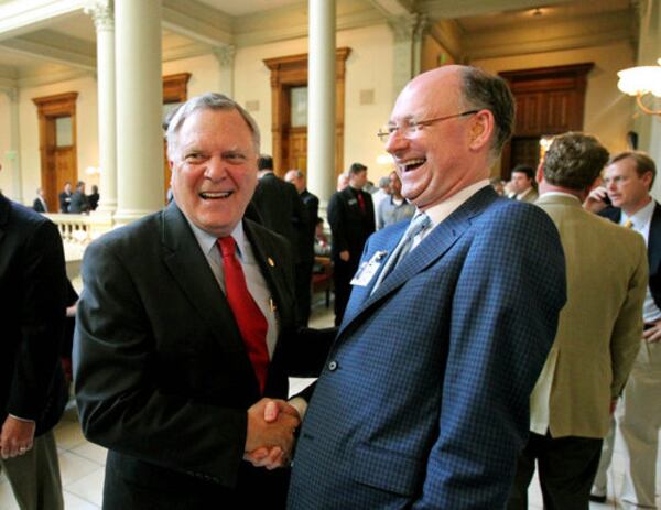 Former Gov. Nathan Deal laughs with Jay Morgan (right) at the State Capitol. (Jason Getz / The Atlanta Journal-Constitution)