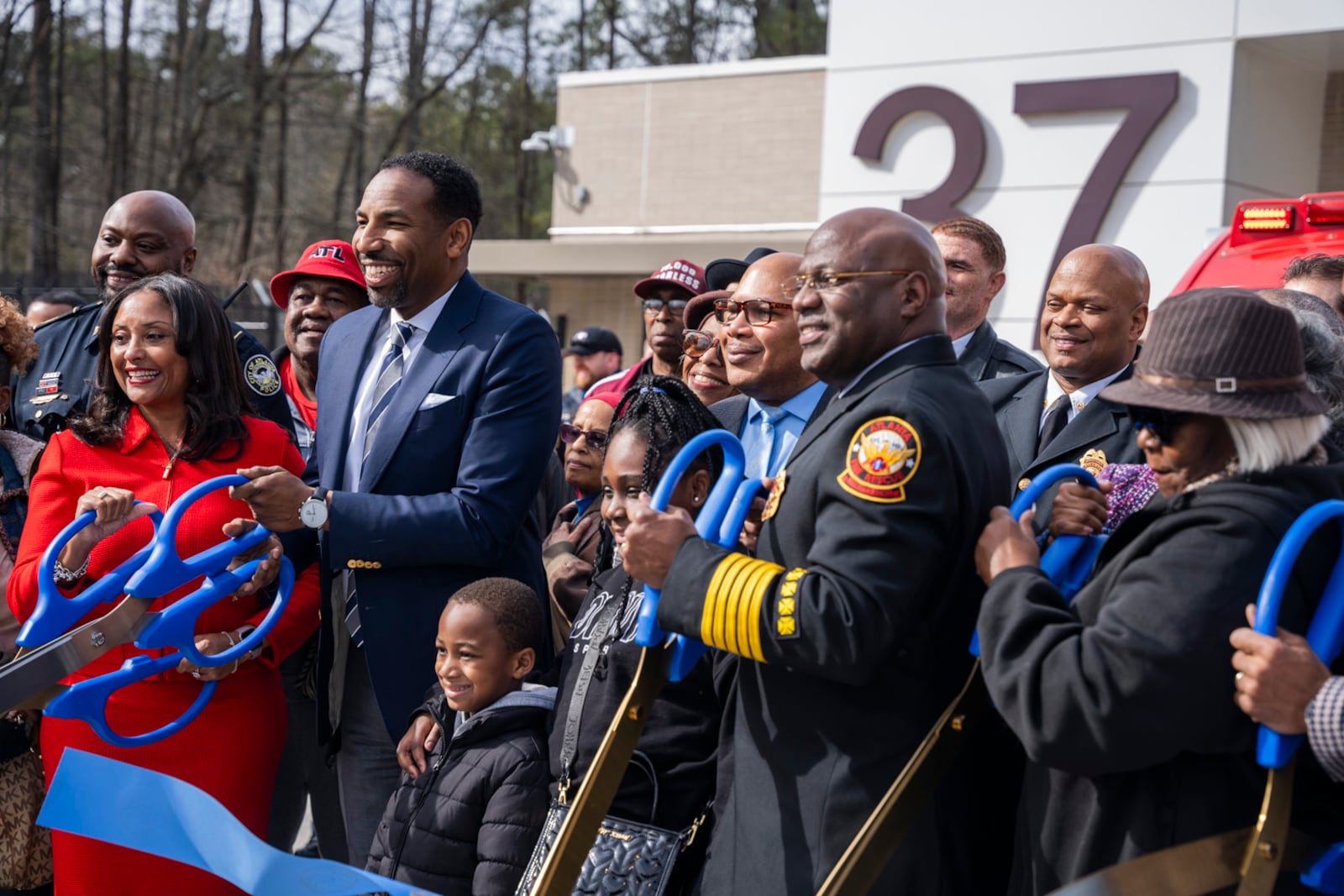 Mayor Andre Dickens and City Council Members speak at the opening of the first fire station in Southwest Atlanta on Thursday, Feb. 8, 2024. (Olivia Bowdoin for the AJC). 