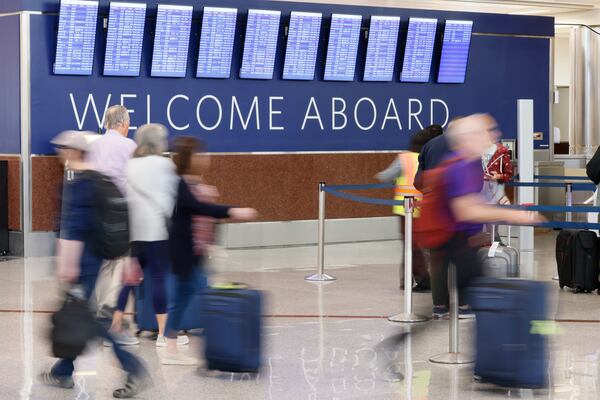 People pass through the South Terminal at the Hartsfield-Jackson International Airport on Thursday, May 26, 2022. About 2 million passengers are expected to pass through its concourses during the Memorial Day holiday from May 26 to June 1. Miguel Martinez / miguel.martinezjimene