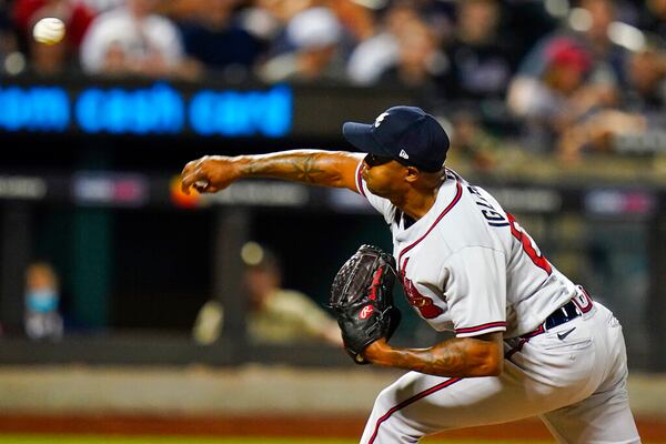 Atlanta Braves' Raisel Iglesias pitches during the eighth inning of a baseball game against the New York Mets, Friday, Aug. 5, 2022, in New York. (AP Photo/Frank Franklin II)