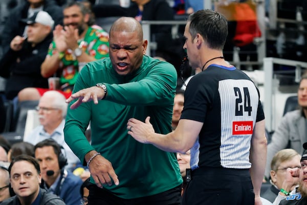 Milwaukee Bucks head coach Doc Rivers argues a call with referee Kevin Scott (24) during the first half of an Emirates NBA Cup basketball game against the Detroit Pistons, Tuesday, Dec. 3, 2024, in Detroit. (AP Photo/Duane Burleson)