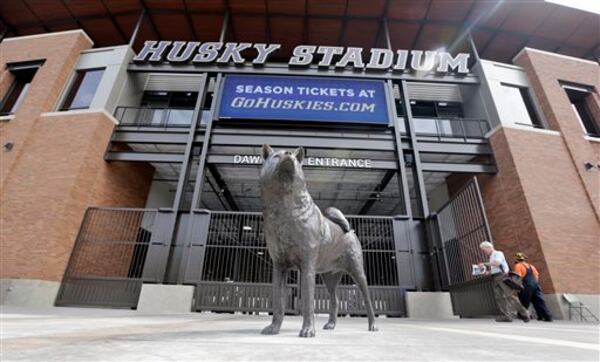 A husky statue guards the student entrance at the newly renovated Husky Stadium Wednesday, Aug. 28, 2013, in Seattle. The $280 million renovation for the home of Washington football, which opens play there Saturday against Boise State, modernized the aging facility. (AP Photo/Elaine Thompson)