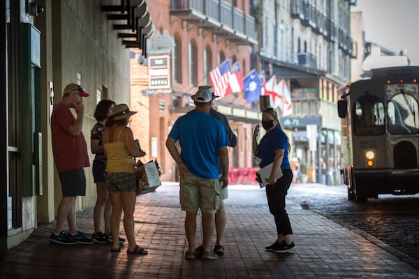 SAVANNAH, GA - Sept. 4, 2020: CoVid Resource Team member Nicole Bush, right, reminds a group of people to wear masks while visiting River Street in historic downtown Savannah. (AJC Photo/Stephen B. Morton)