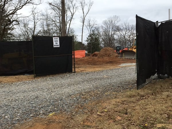 Neighborhoods across Atlanta — including this property in the Tuxedo Park neighborhood — are seeing swaths of old trees come down as new houses go up. Photo by Mercy Sandberg-Wright