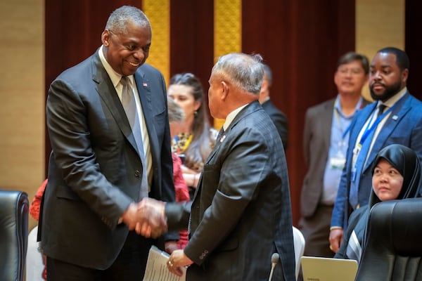 U.S. Defence Secretary Lloyd Austin, left, shakes hands with Brunei's Defence Minister II Halbi Bin Mohammad Yussof during the ASEAN Defence Ministers' informal Meeting in Vientiane, Laos, Wednesday, Nov. 20, 2024. (AP Photo/Anupam Nath)