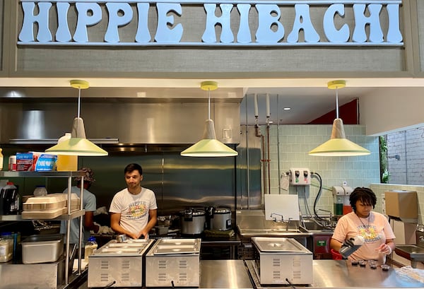 Hippie Hibachi owner Josh Brock and cashier Tatyana Defoor mind the shop at the vegan takeout stall at Chattahoochee Food Works. Wendell Brock for the Atlanta Journal-Constitution