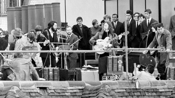 The performance was a part of filming for a documentary of the band rehearsing and recording the album Let It Be. The 42 minute session drew crowds to the street & adjoining rooftops. This was the band's final live performance before breaking up in April 1970. Performing on the rooftop left to right: Ringo Starr, Paul McCartney, John Lennon and George Harrison.