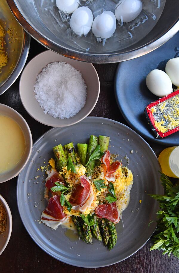 A possible dish for an Easter brunch is Grilled Spring Asparagus, Crumbled Hard-boiled Egg and Jamón Ibérico, from Andy Peterson, executive chef at the Iberian Pig. (Styling by executive chef Andy Peterson / Chris Hunt for the AJC)