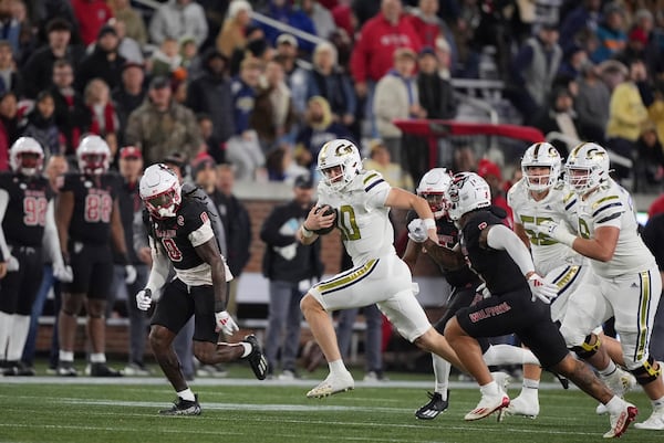 Georgia Tech quarterback Haynes King (10) runs the ball during the first half of an NCAA college football game against North Carolina State, Thursday, Nov. 21, 2024, in Atlanta. (AP Photo/Brynn Anderson)