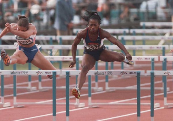 Gail Devers of the U.S. women's track and field team jumps the last hurdle to win her heat of the women's 100-meter hurdles Monday, July 29, 1996, at the 1996 Summer Olympic Games in Atlanta. (Todd Warshaw/Allsport)