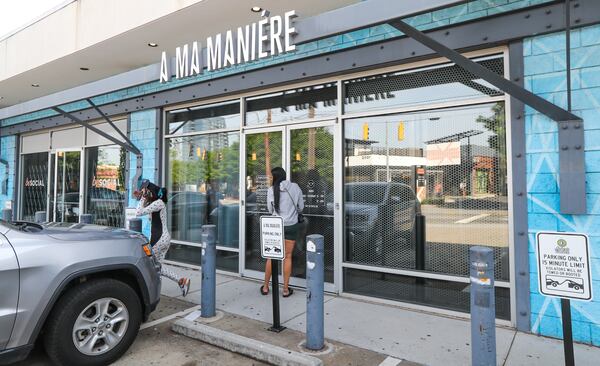 Atlanta police officers were met with gunfire while investigating a burglary Thursday morning at A Ma Maniére on Marietta Street. One officer was injured.