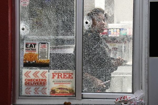 Crime tape, shattered glass and an order of chicken was all that was left after gunfire erupted at a DeKalb County fast-food restaurant in early March 2020. JOHN SPINK/JSPINK@AJC.COM

